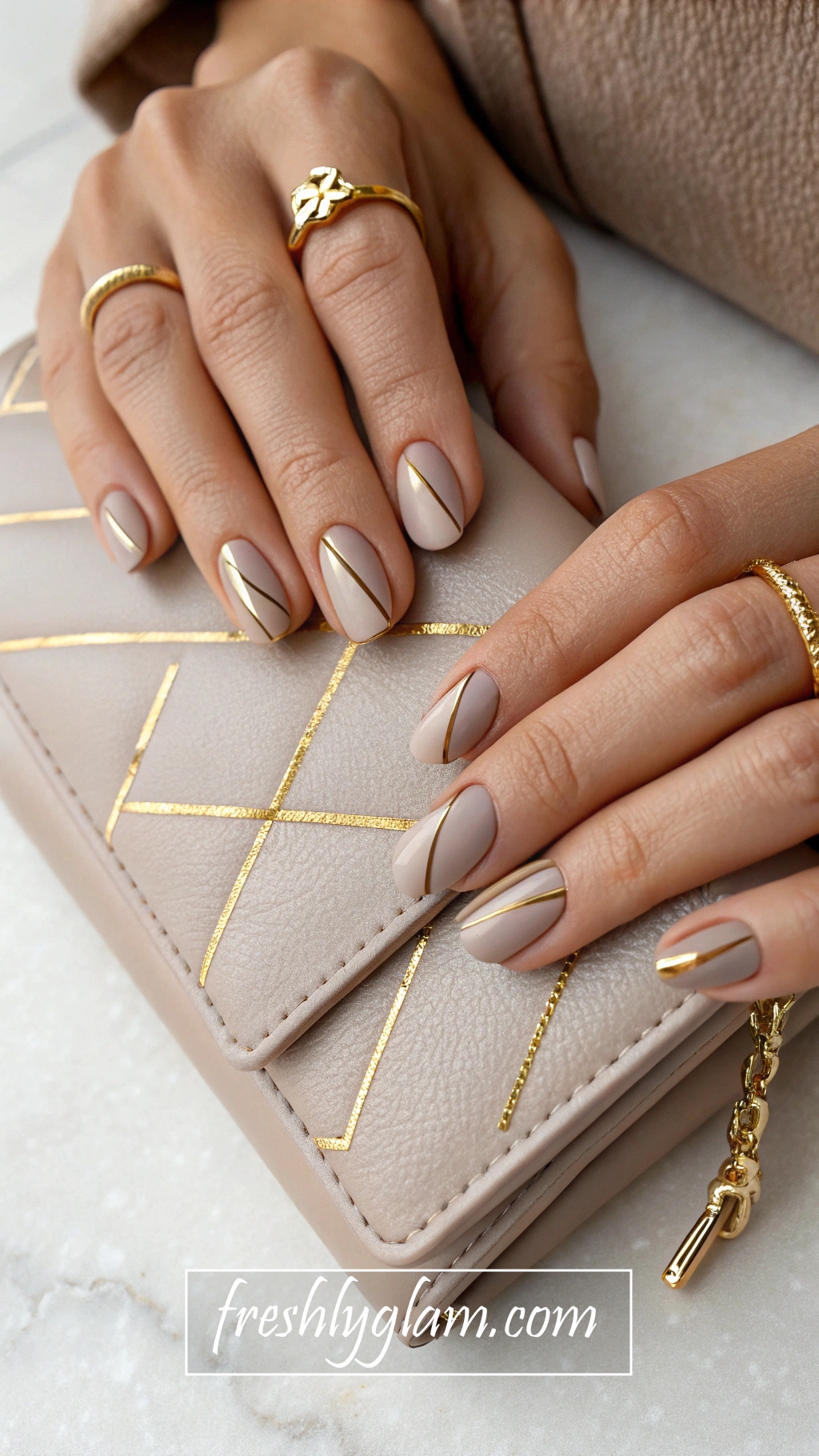 020 Glossy Taupe Nails with Gold Lines Luxe Minimalist Nail Art for Couture Moments