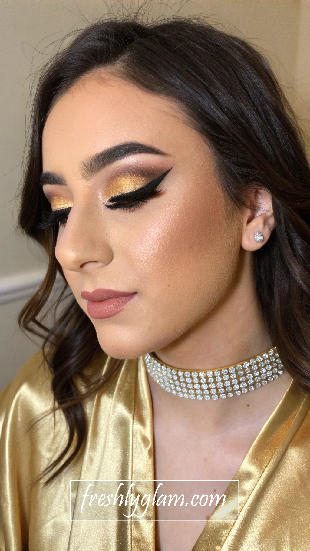 023 Dramatic Black Gold Eye Makeup Look with Winged Liner and Opulent Accents 1