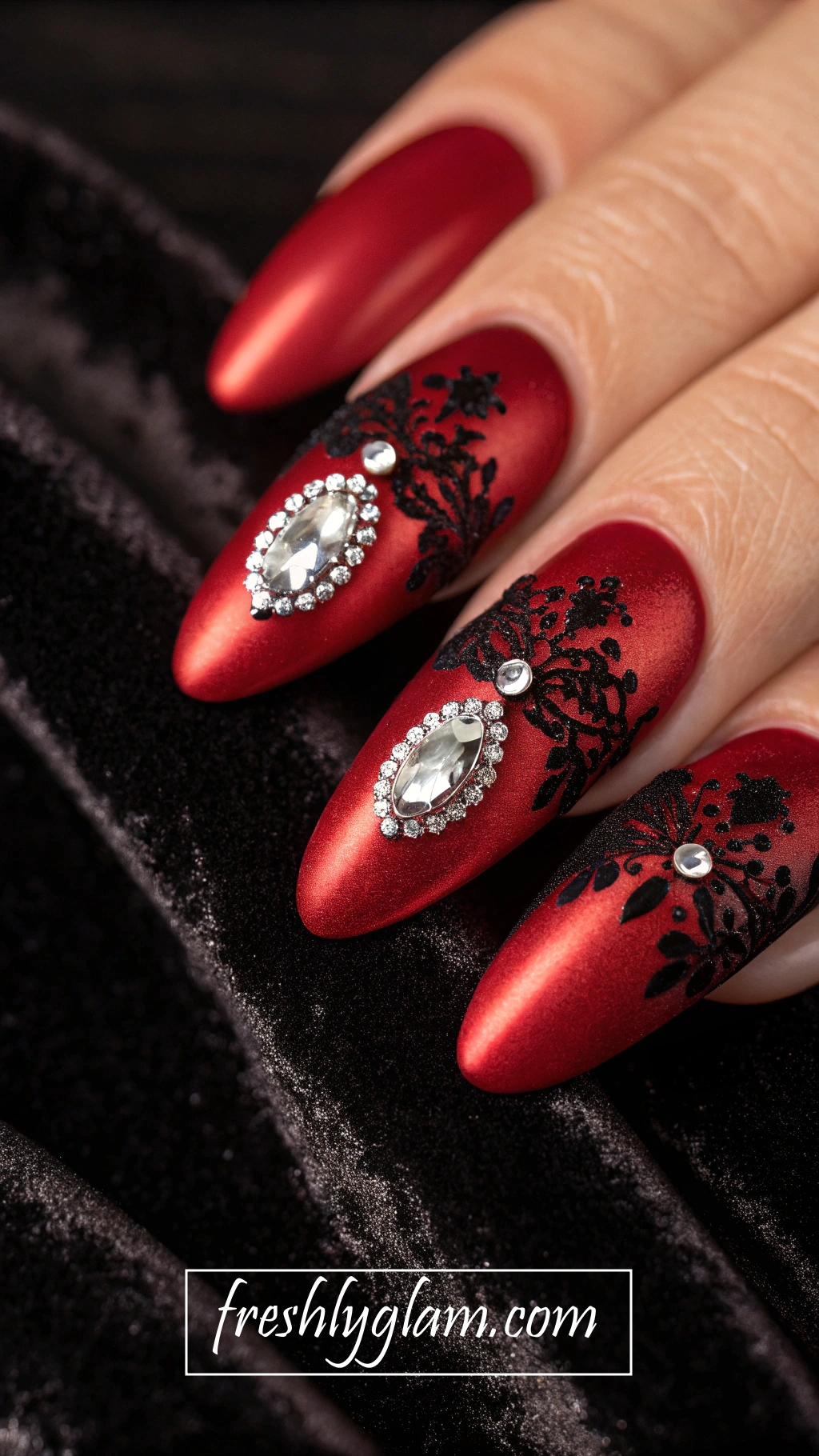 083 Red Chrome and Black Lace Almond Nails with Rhinestones for the Glamorous Sophisticate